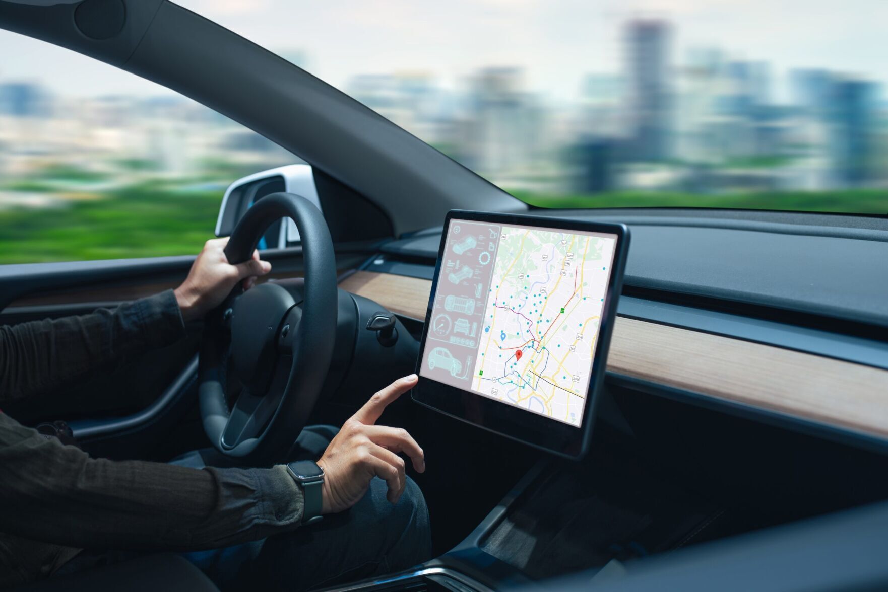 Person,Driving,A,Car,While,Interacting,With,A,Modern,Touchscreen
